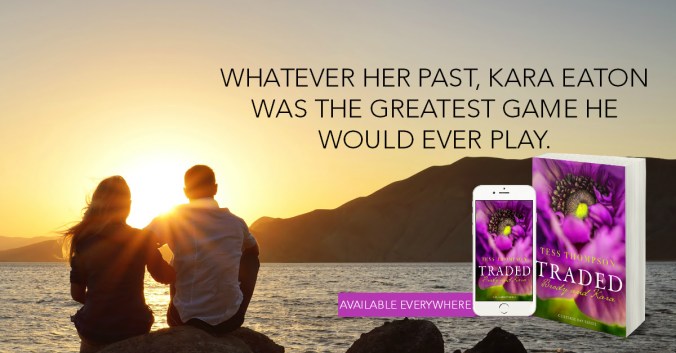 Young couple sitting on a rock near the sea and watching the sun