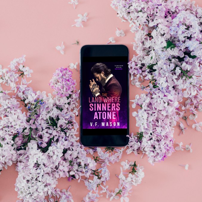 Smart phone with a bouquet of lilacs on pink background. Flat lay, top view